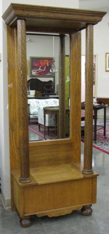 Appraisal: Oak hall seat with storage seat mirrored back post column