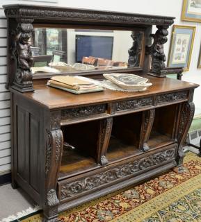 Appraisal: Oak sideboard with mirror back and putti shelf supports no