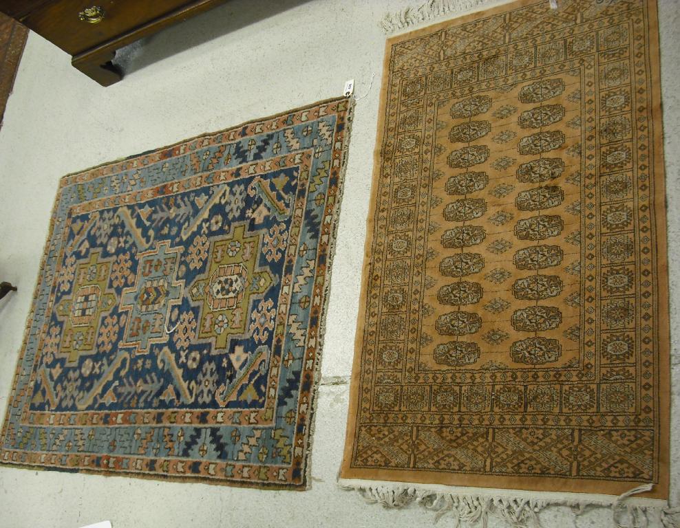 Appraisal: Eastern rug with three medallions on an indigo foliate field