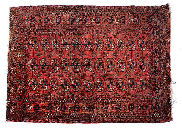 Appraisal: AN OLD TEKKE TURKOMAN WINE GROUND RUG with three rows