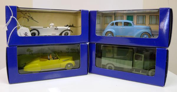 Appraisal: FOUR EN VOITURE TINTIN FIGURES FROM TINTIN COMICS RELEASED IN