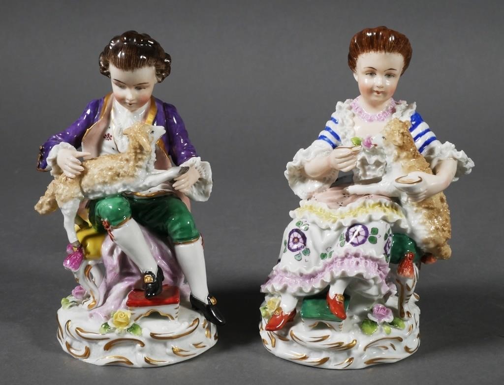 Appraisal: Porcelain figurines of a boy and a girl each seated