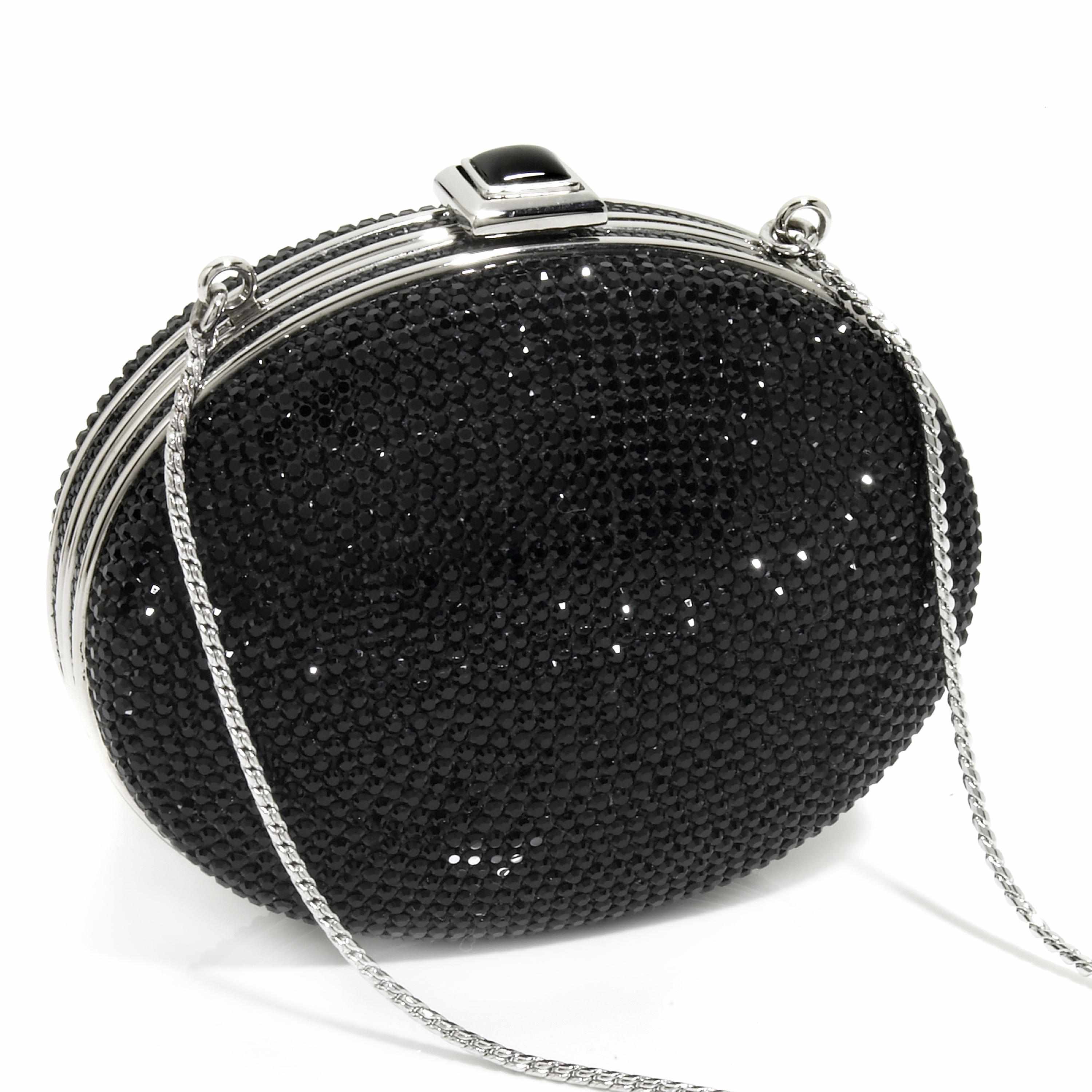 Appraisal: An oval-shaped black crystal purse with silver colored metal detailing