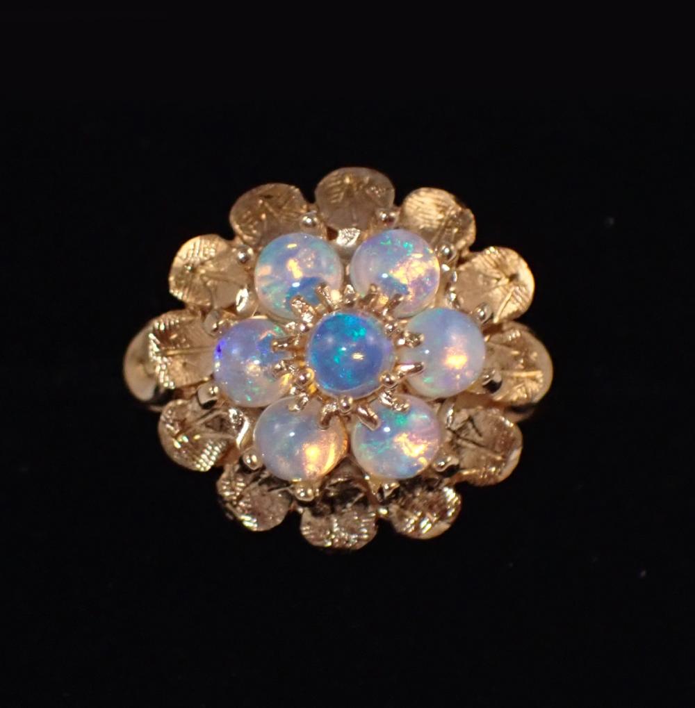 Appraisal: OPAL AND FOURTEEN KARAT GOLD CLUSTER RING with seven round