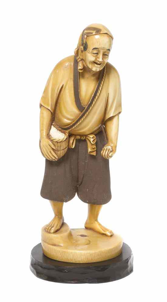 Appraisal: A Japanese Carved Ivory Okimono depicting a barefoot elderly man