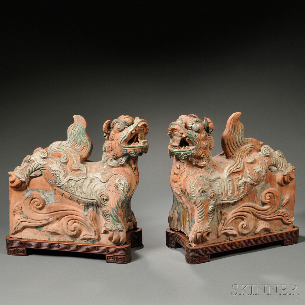 Appraisal: Pair of Pottery Lion-shaped Stands China glazed in green and