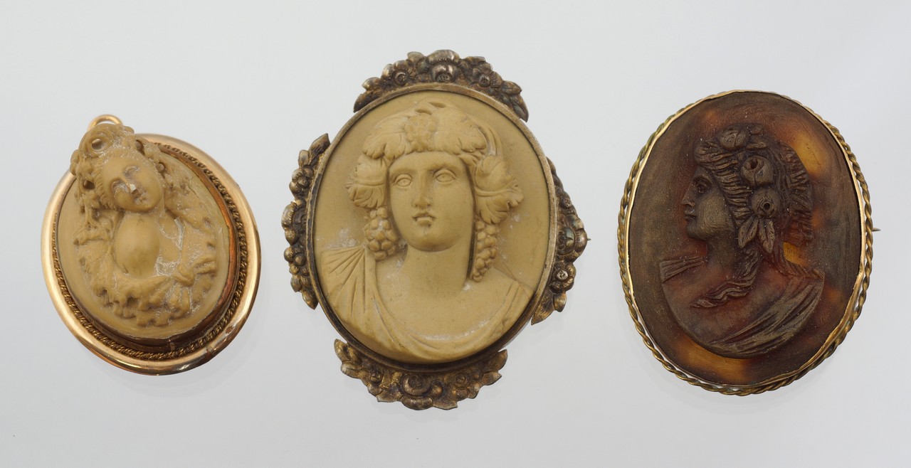 Appraisal: oval carved lava cameo bust portrait pins GF or silver