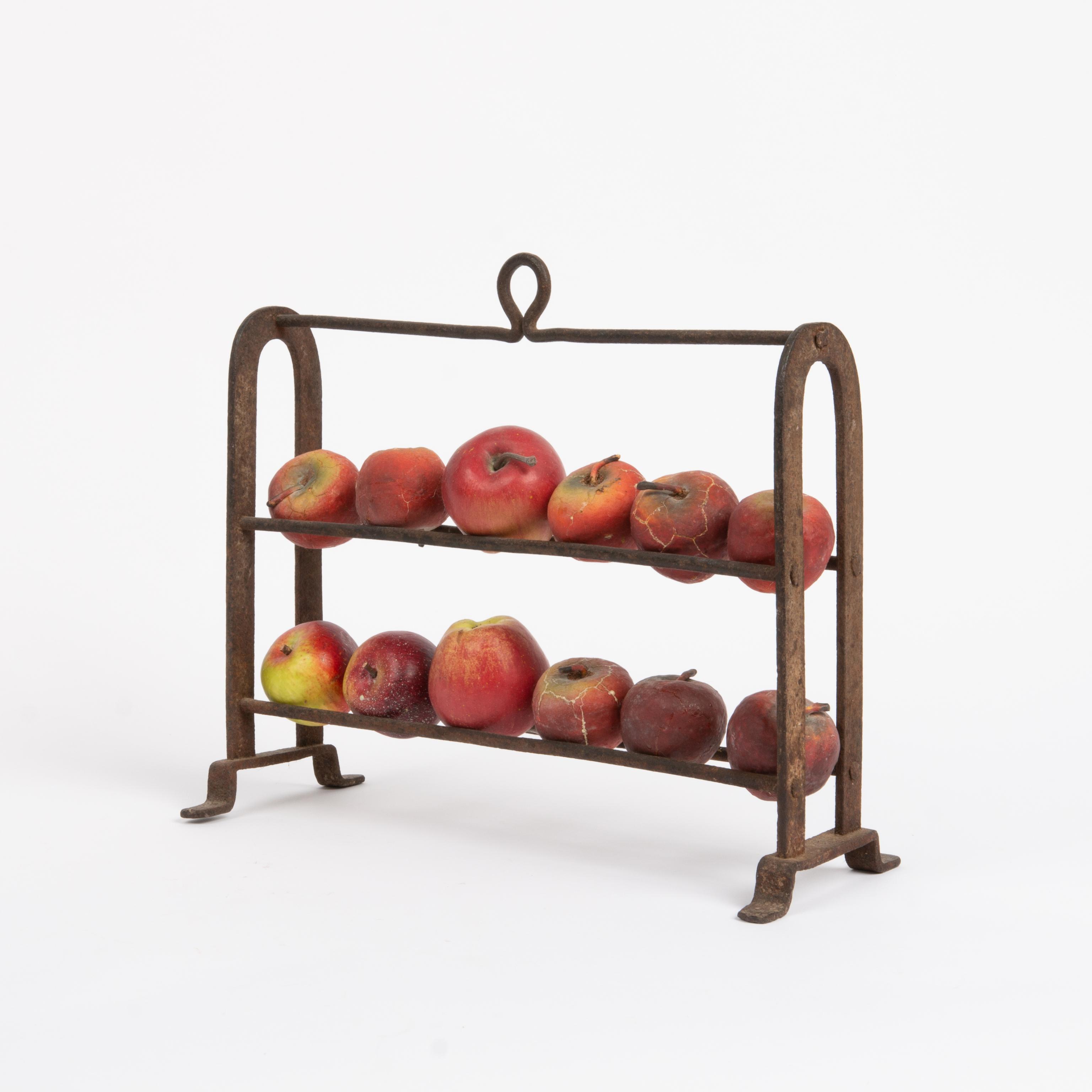 Appraisal: WROUGHT IRON APPLE ROASTER TH C A wrought iron standing