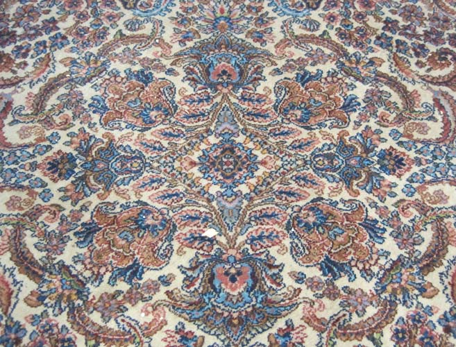 Appraisal: KARASTAN AMERICAN ORIENTAL CARPET Kerman floral design on cream ground