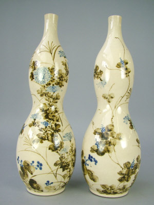 Appraisal: A pair of Japanese earthenware double gourd vases cream ground