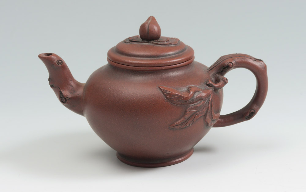 Appraisal: CHINESE YIXING ZISHA TEAPOT BY JIANG RONG Terracotta teapot emulating