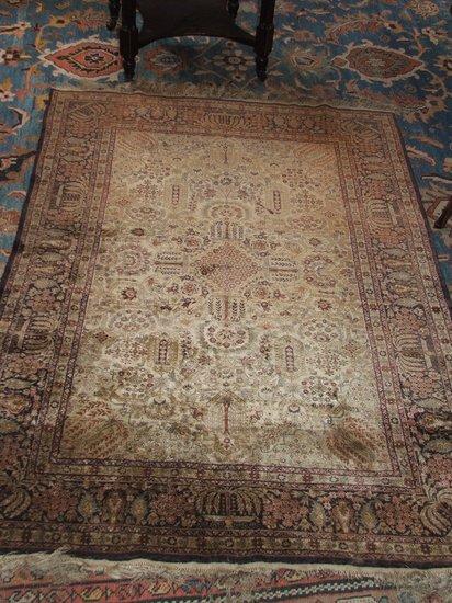 Appraisal: AN OLD PERSIAN SILK RUG decorated an intense pattern of