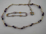 Appraisal: A white metal tests silver necklace with amethyst beads approx