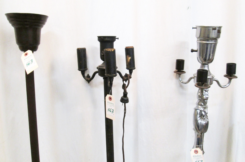 Appraisal: THREE VINTAGE FLOOR LAMPS WITHOUT SHADES figural chromed metal standard