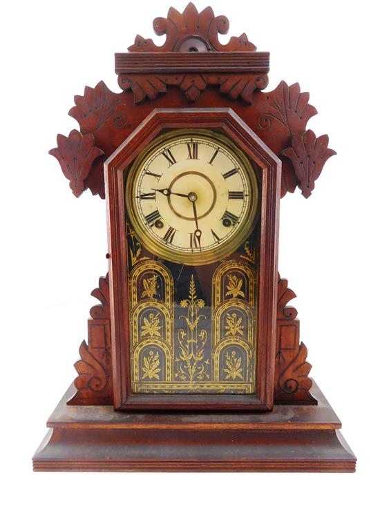 Appraisal: CLOCK Ingraham gingerbread parlor clock walnut case with applied carving