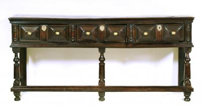 Appraisal: AN OAK DRESSER th century the cavetto moulded two plank