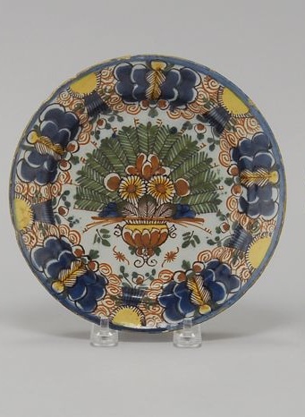 Appraisal: DELFT POTTERY PEACOCK PLATE Circa With polychrome decoration and blue