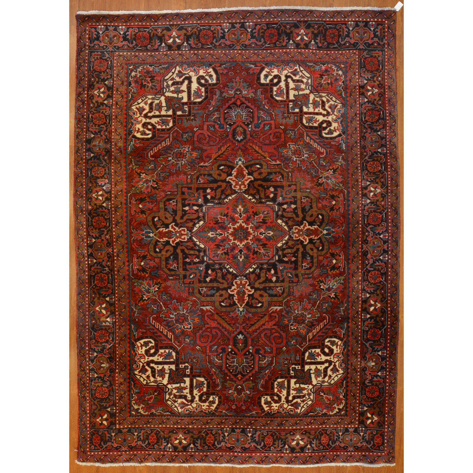 Appraisal: HERIZ RUG PERSIA X Fourth quarter- th century hand-knotted wool