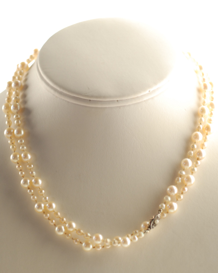 Appraisal: An Opera Length Pearl Necklace the cultured pearls in two