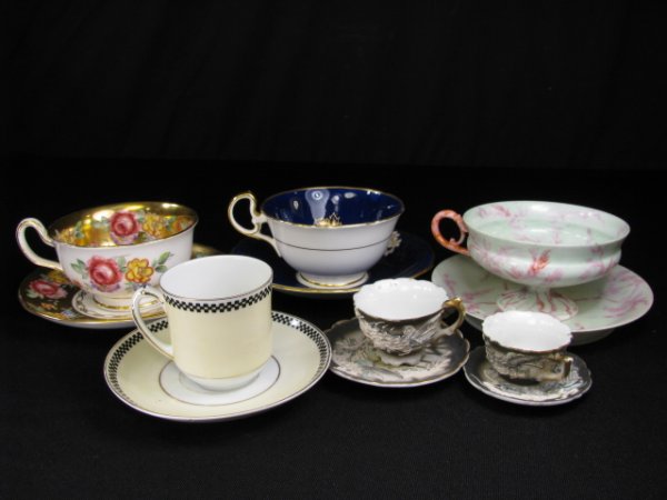 Appraisal: Three normal size porcelain cups and saucers largest Limoges high