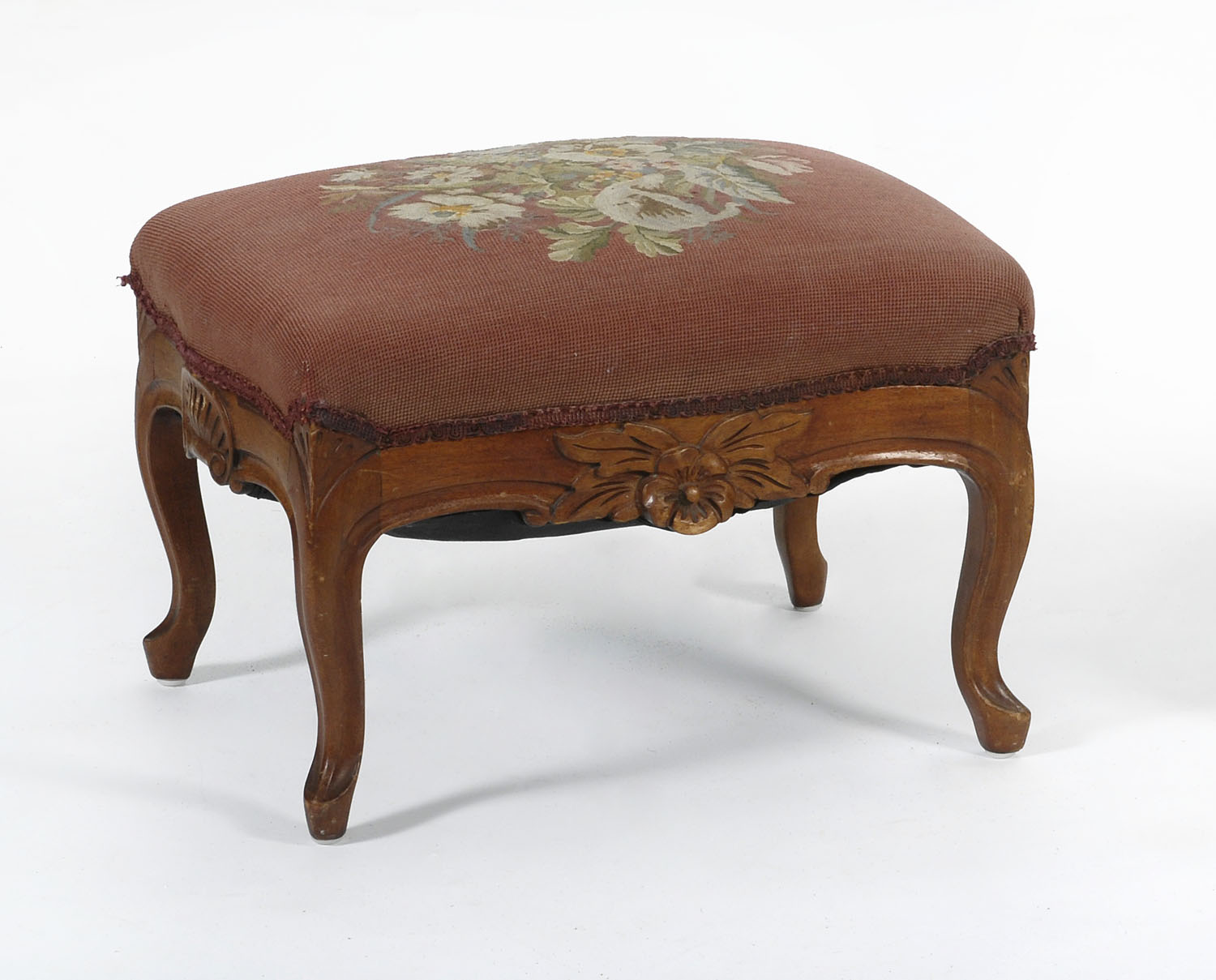 Appraisal: MID- TH CENTURY VICTORIAN FOOTSTOOL with floral-carved walnut frame Seat