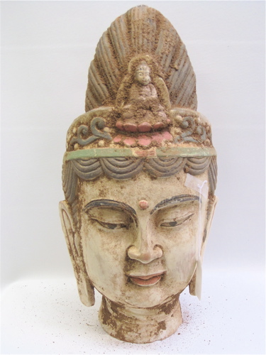 Appraisal: SCULPTED POTTERY HEAD OF GAUTAMA BUDDHA with colorful traces of