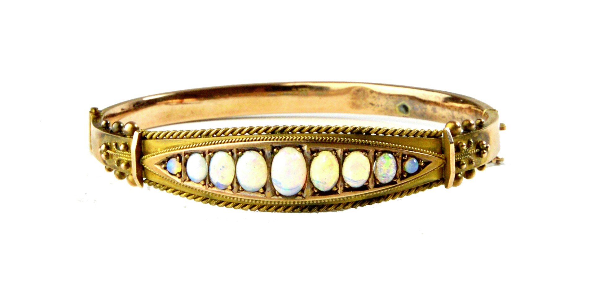 Appraisal: A ct gold and opal set oval hinged bangle mounted