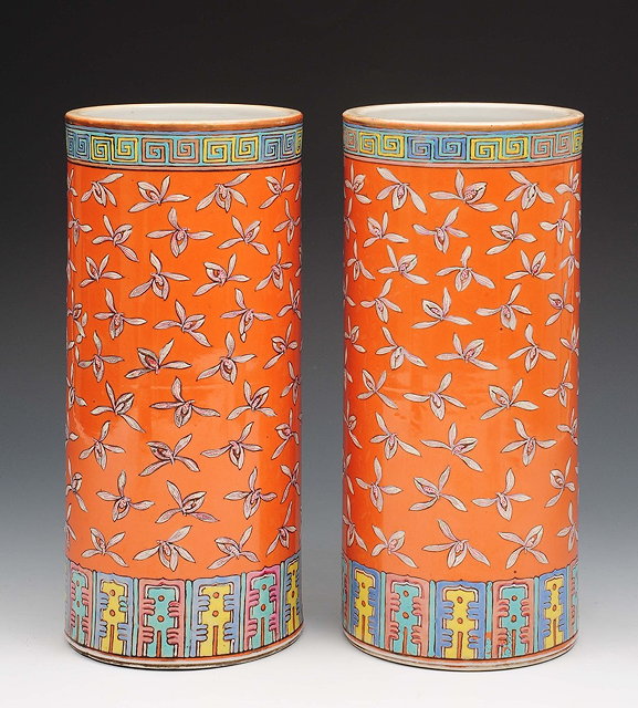 Appraisal: A pair of Chinese coral ground cylindrical vases th Centurywith