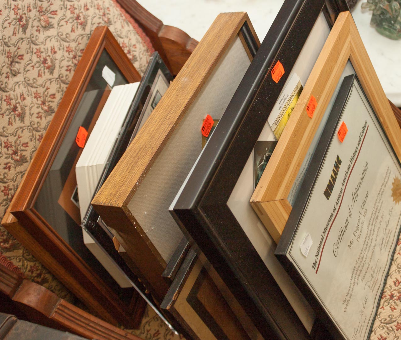 Appraisal: Sixteen framed articles including souvenir items prints stamps and other