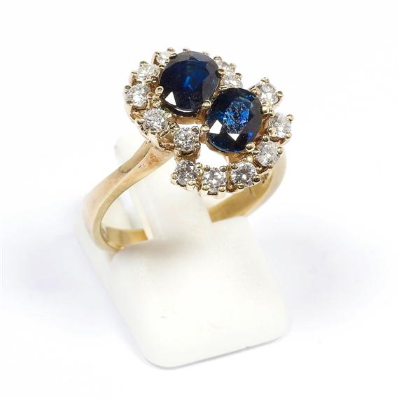 Appraisal: SAPPHIRE AND DIAMOND RING ca Yellow gold Decorative crossover ring