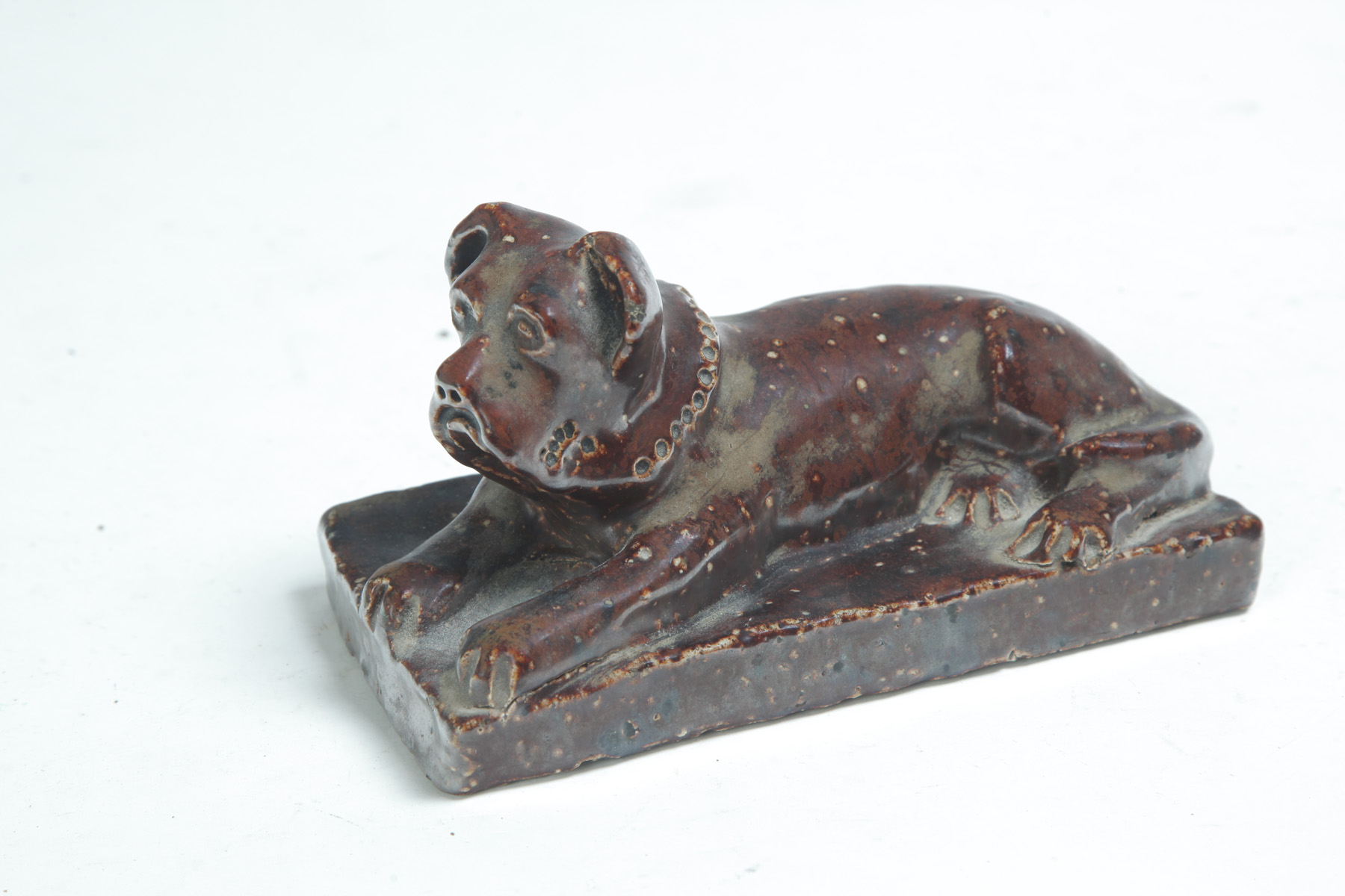 Appraisal: AMERICAN SEWERTILE DOG First half- th century Reclining mastiff l