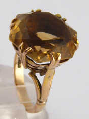 Appraisal: A yellow metal tests carat gold citrine ring the hexagonal