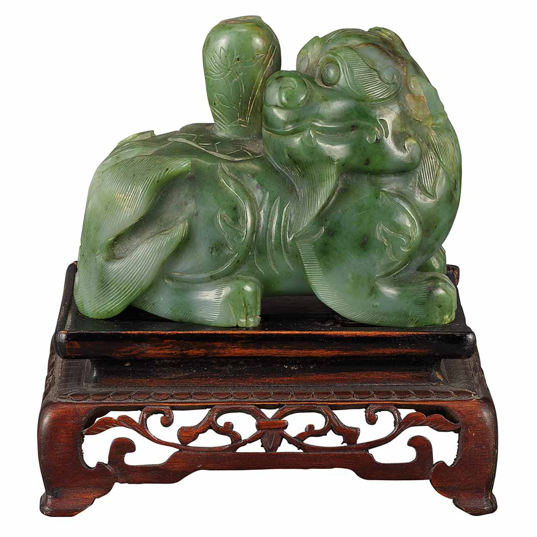 Appraisal: Chinese Spinach Jade Recumbent Qilin th Century The beast lying