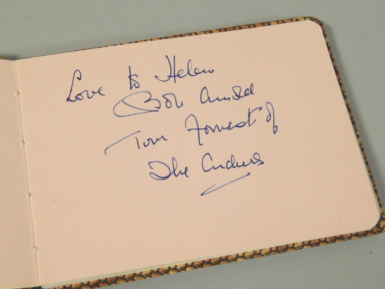 Appraisal: An autograph album containing various signatures to include Ken Dodd