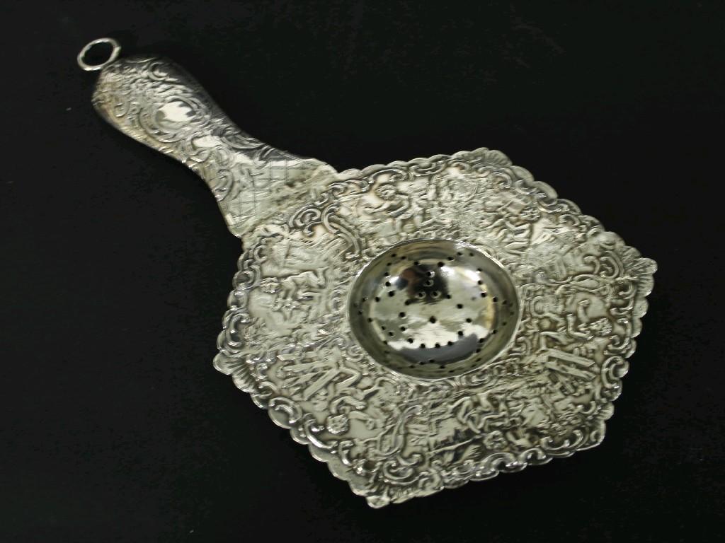 Appraisal: Late Victorian silver tea strainer of hexagonal form embossed with