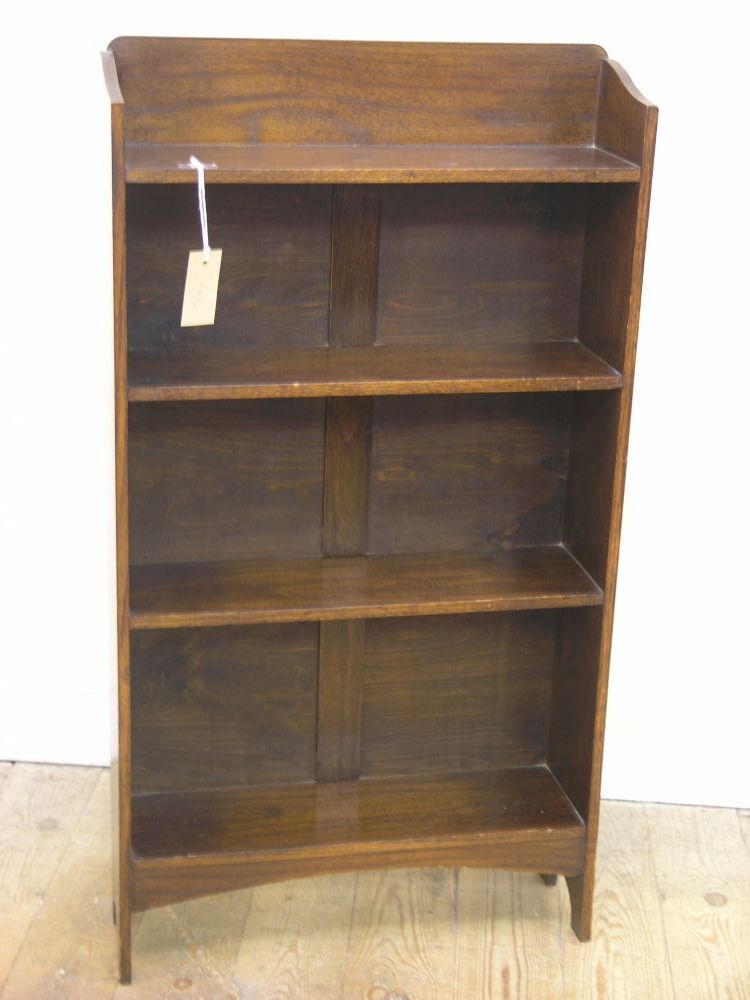 Appraisal: A dark oak open bookcase of four shelves ft in