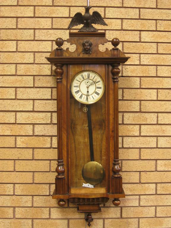 Appraisal: A Vienna Wall Clock in walnut case with eagle surmount