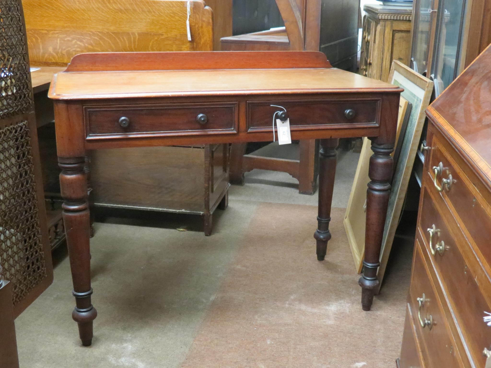 Appraisal: A Victorian mahogany side table two frieze drawers each with