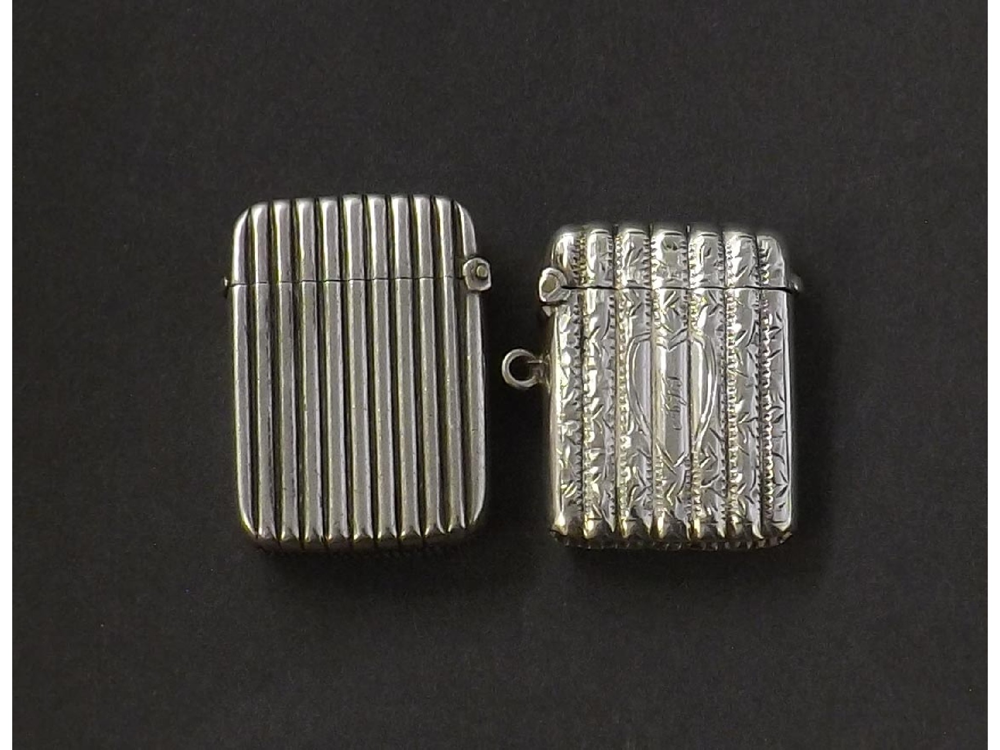 Appraisal: Two small silver vesta cases each with pin striped decoration