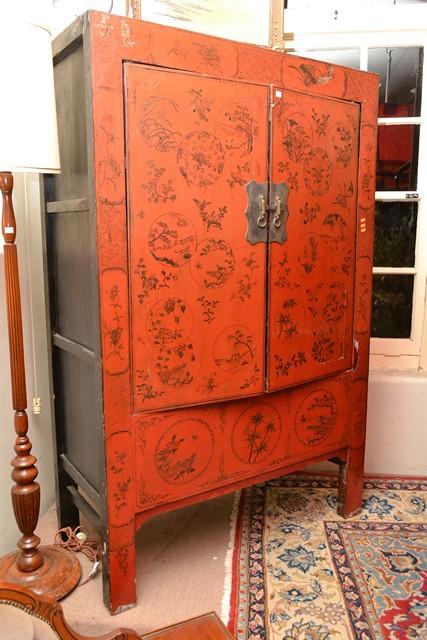 Appraisal: A RED LACQUERED ORIENTAL CUPBOARD