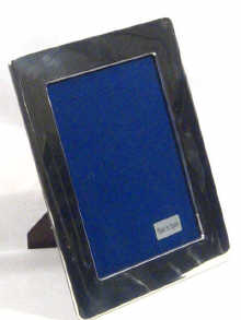 Appraisal: A modern boxed rectangular silver picture frame picture size cm