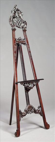 Appraisal: An Edwardian carved mahogany gallery easel circa the cartouche shaped