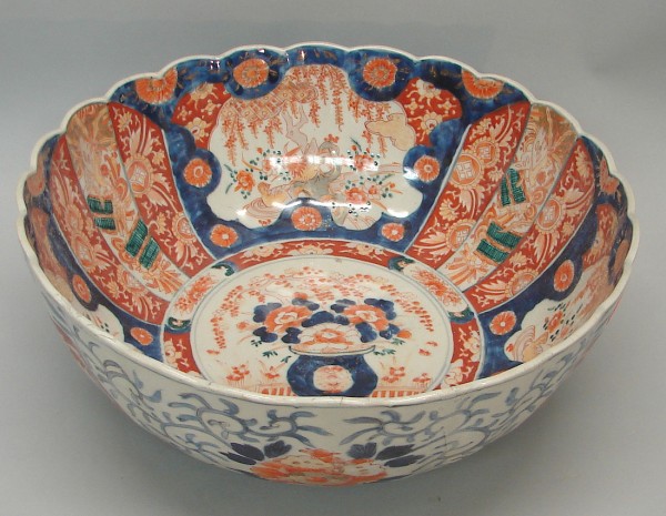 Appraisal: Large bowl features scalloped rim central medallion with floral motif