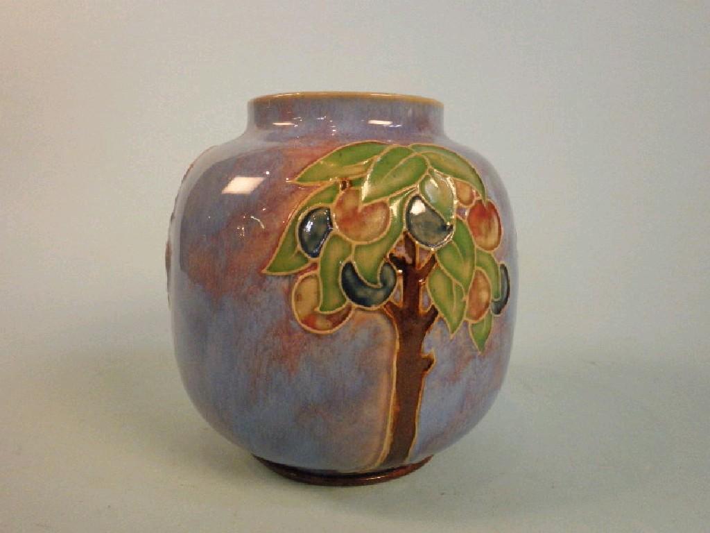 Appraisal: A Royal Doulton stoneware vase decorated with fruit trees on