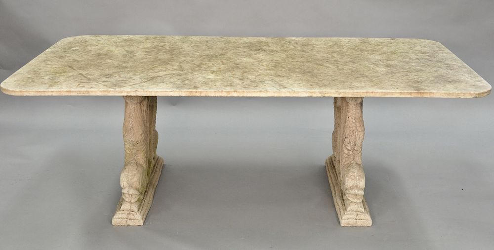 Appraisal: Outdoor table having marble top on base of two cement