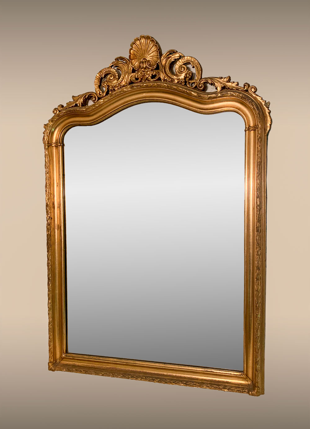 Appraisal: CARVED GILT WALL MIRROR Gilt wall mirror surmounted by a