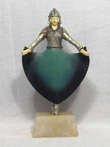 Appraisal: An art deco style figure of a lady in armour