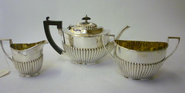 Appraisal: A COMPOSITE EDWARDIAN THREE PIECE TEA SET maker William Atkin