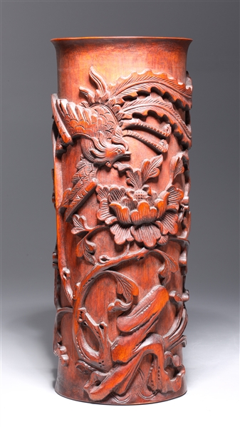 Appraisal: Chinese wooden brush pot with elaborately carved floral designs in