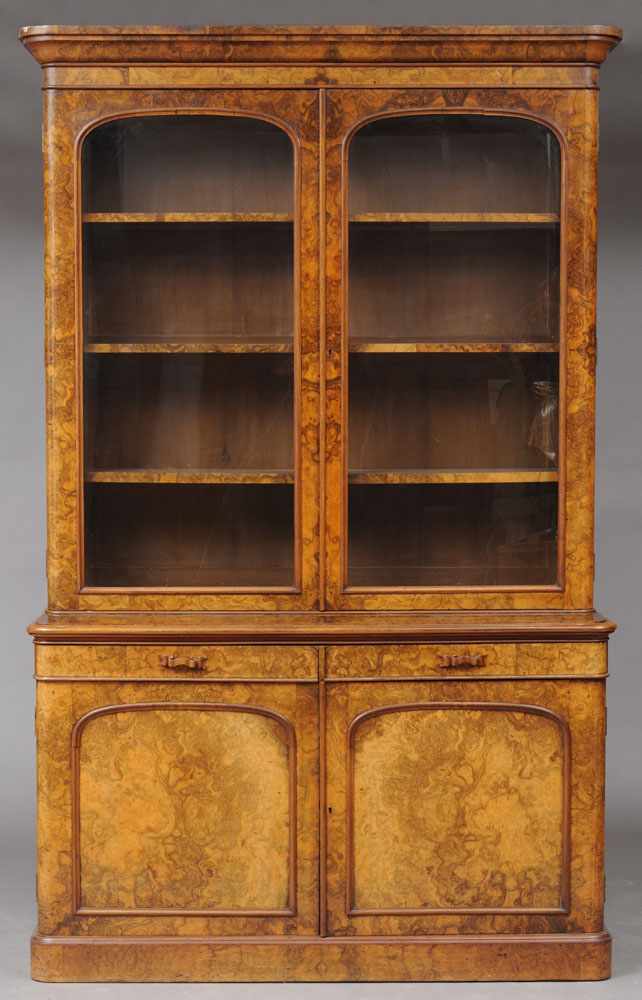 Appraisal: VICTORIAN BURR WALNUT BOOKCASE CABINET The molded cornice above a